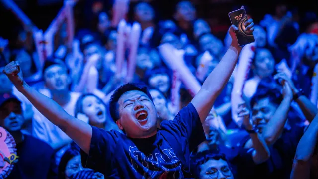 A League of Legends fan cheers at MSI 2024 in Chengdu, China.