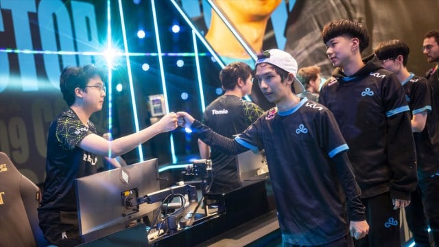 Blaber and C9 fistbump their opponents on stage during the LCS 2024 Summer Split.